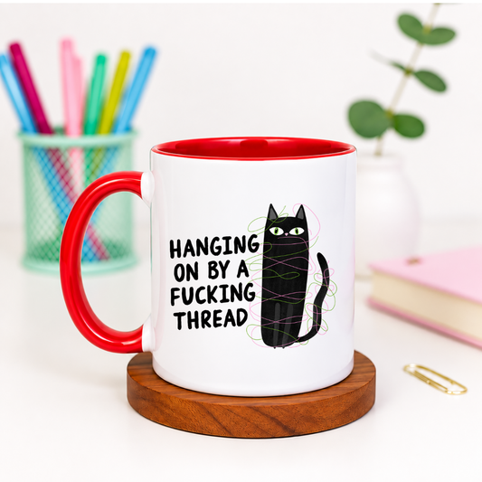 Hanging On by a Fucking Thread - Ceramic Mug